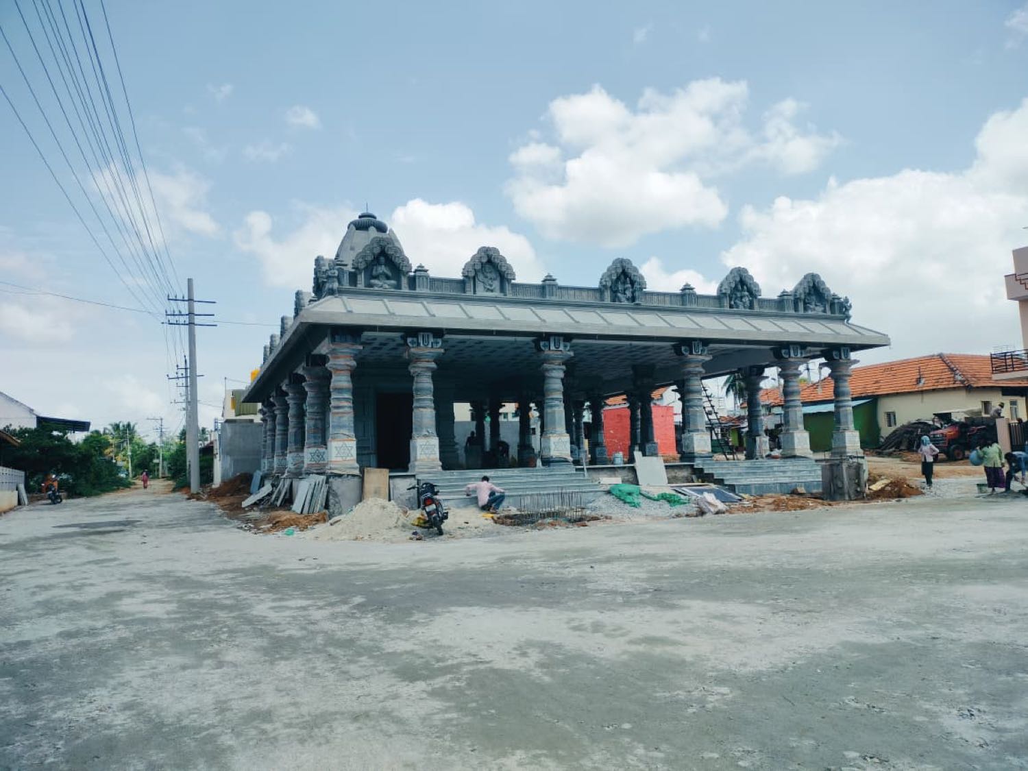 The open pillared porch, nearing completion